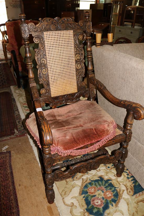 Carolean style carved oak caned seat and back elbow chair